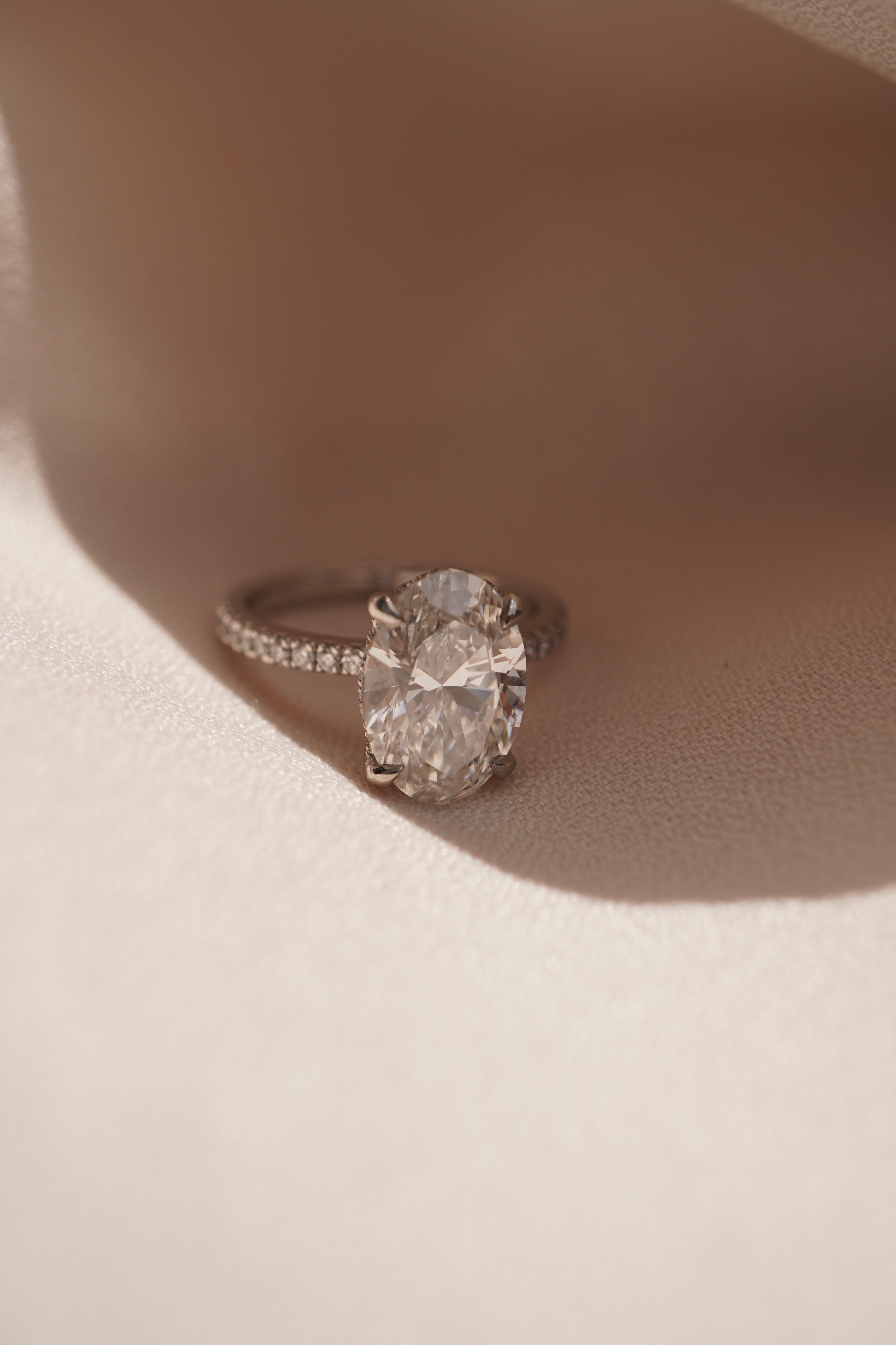 Oval Accented Solitaire with Hidden Halo