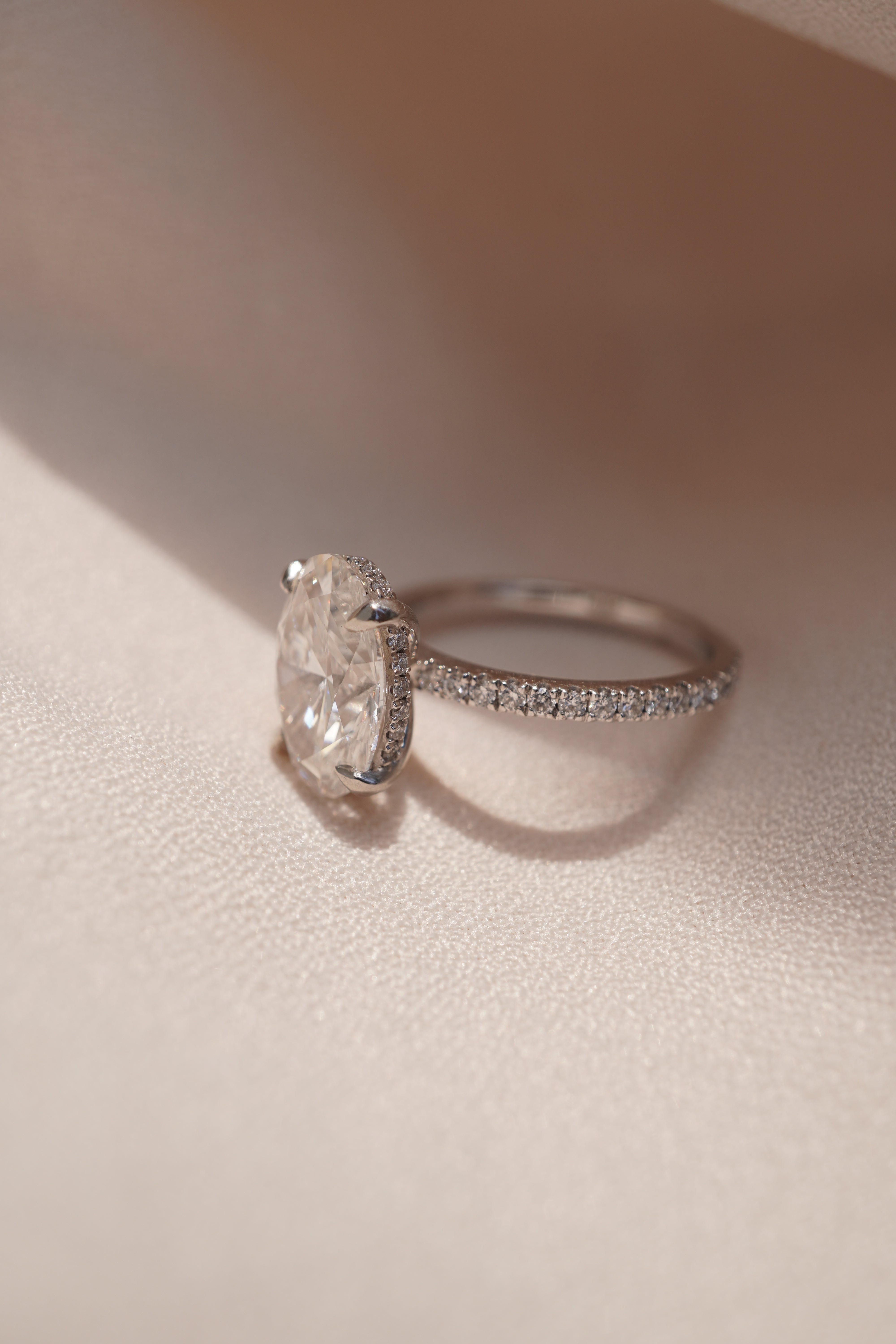Oval Accented Solitaire with Hidden Halo