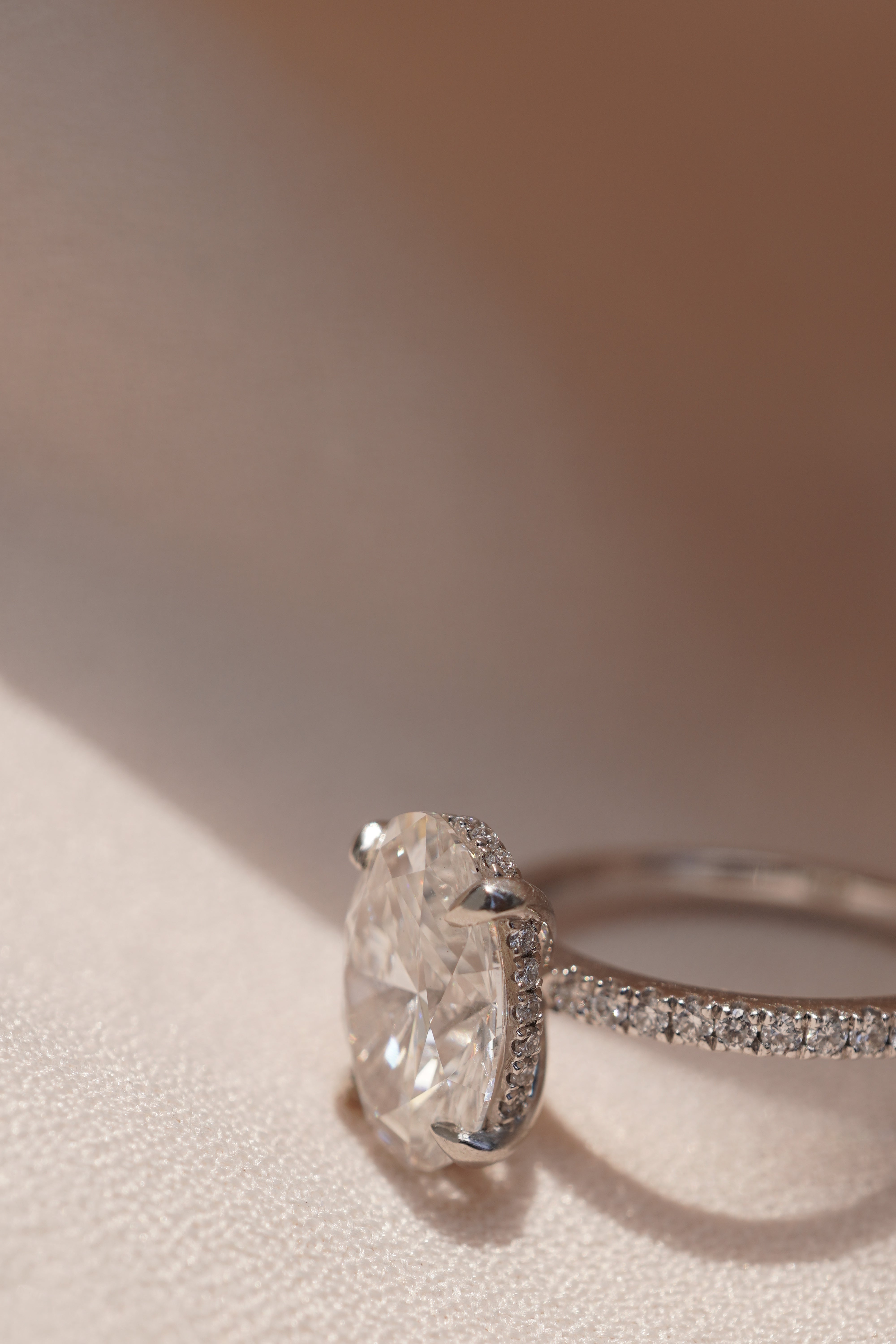 Oval Accented Solitaire with Hidden Halo