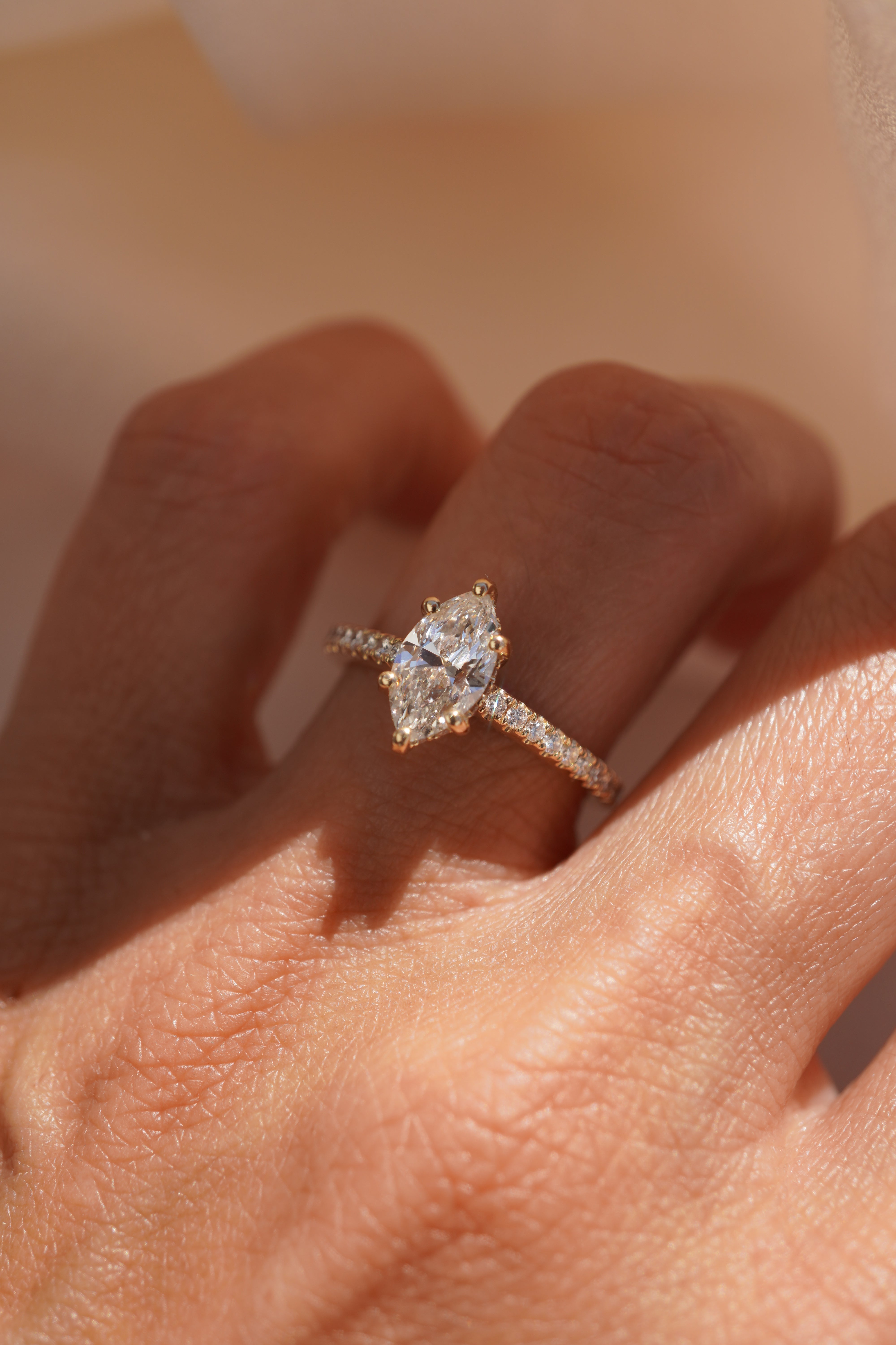 Marquise Accented Solitaire with Hidden Halo and Pave Bridge