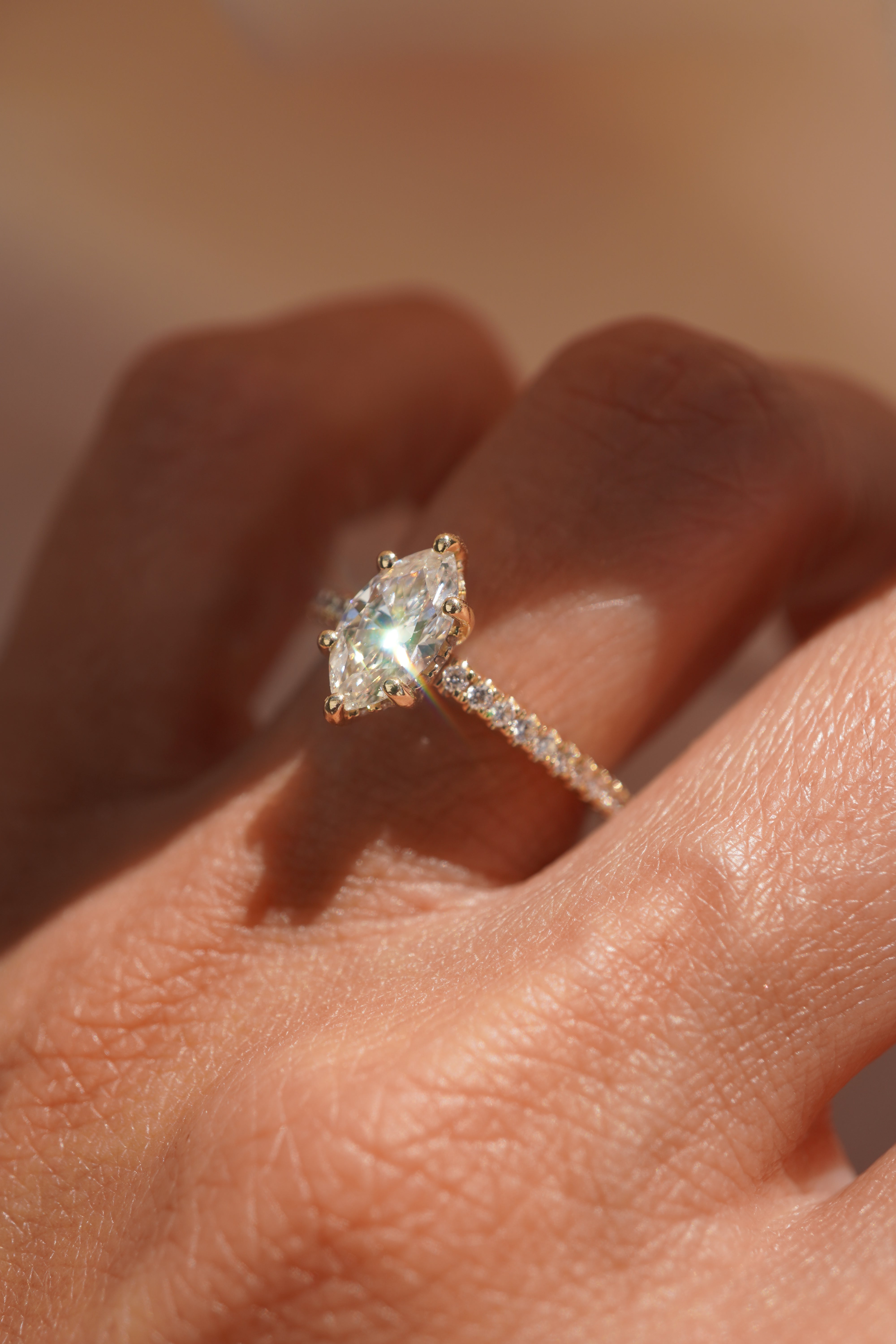 Marquise Accented Solitaire with Hidden Halo and Pave Bridge