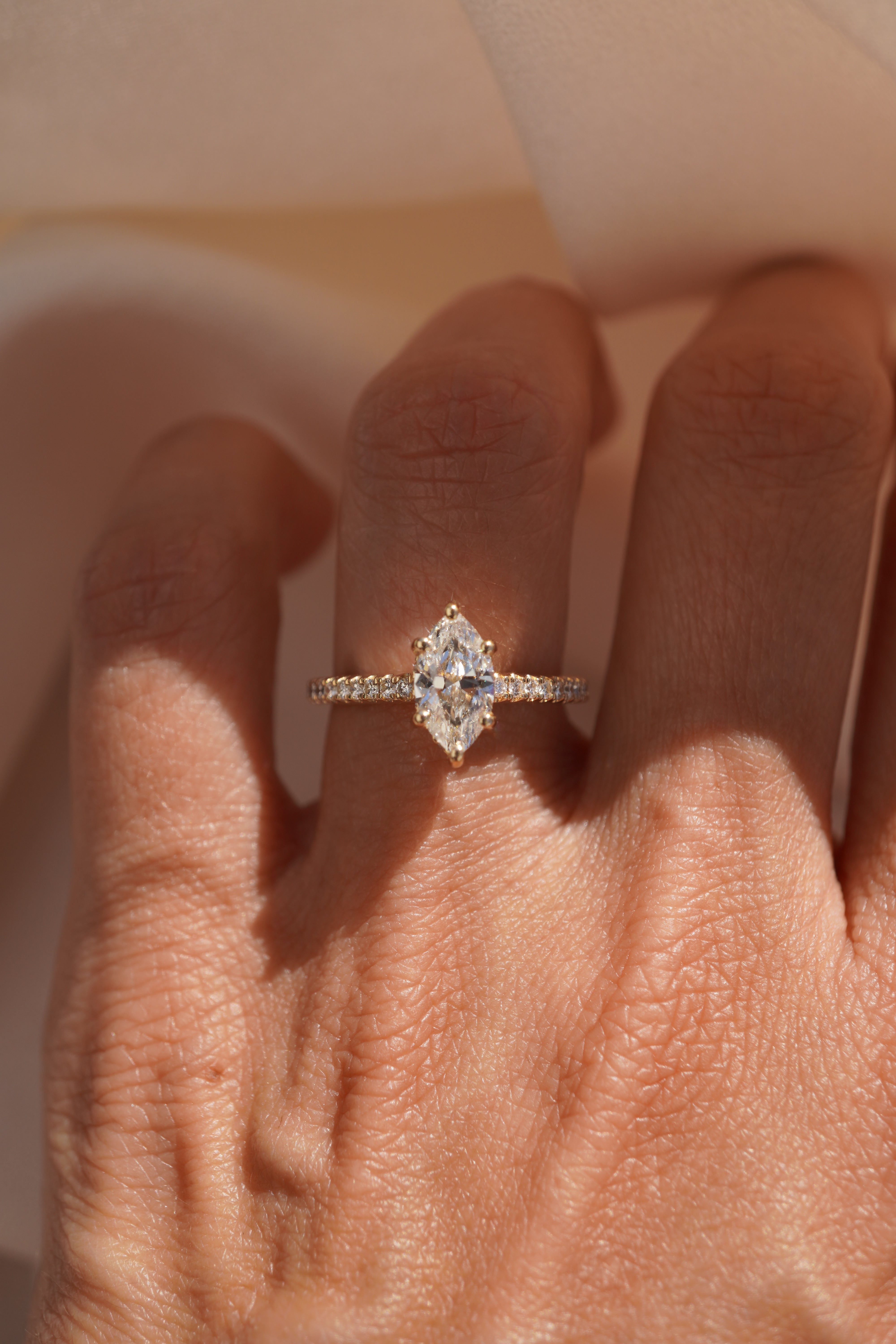 Marquise Accented Solitaire with Hidden Halo and Pave Bridge