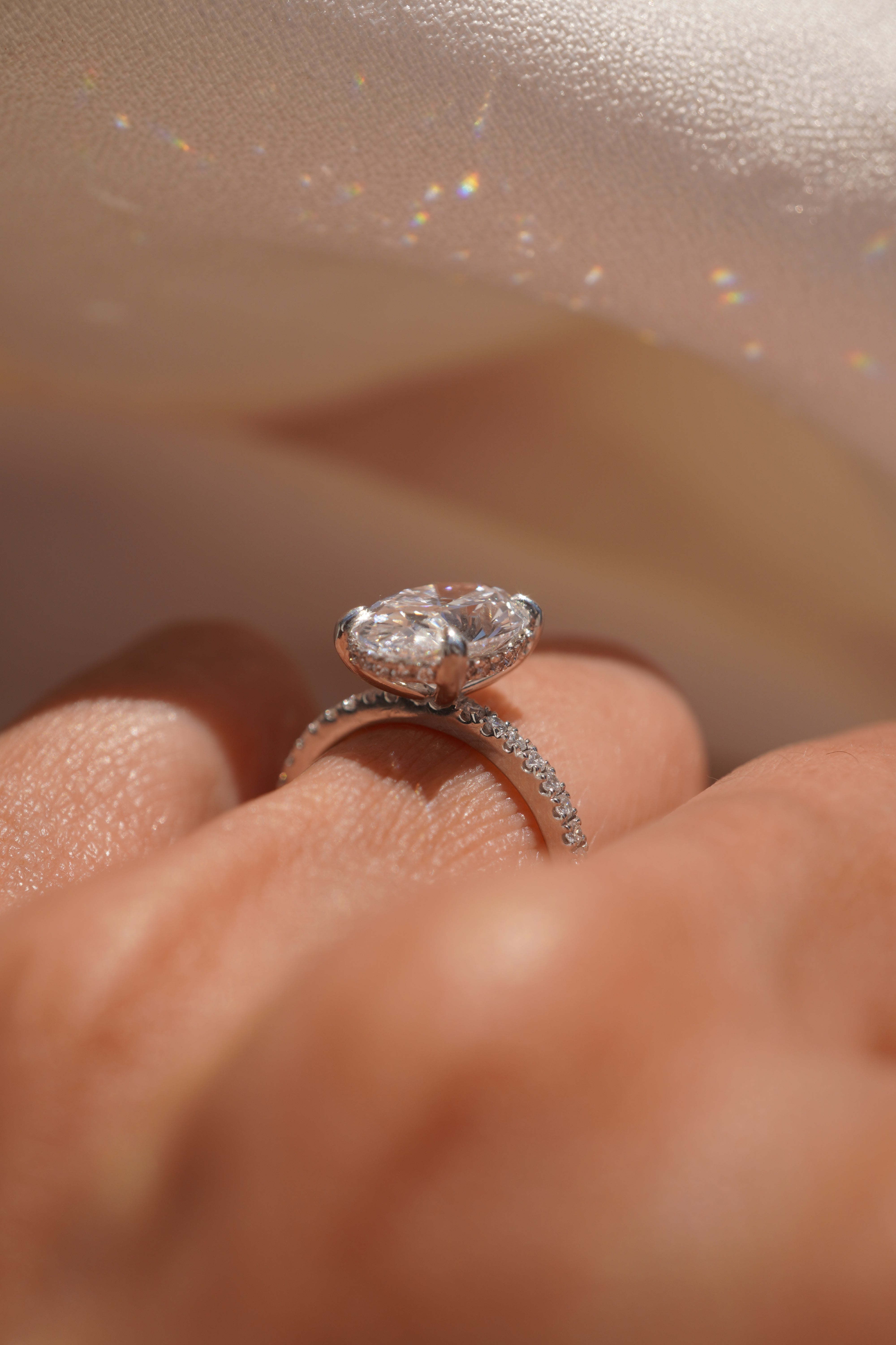 Oval Accented Solitaire with Hidden Halo