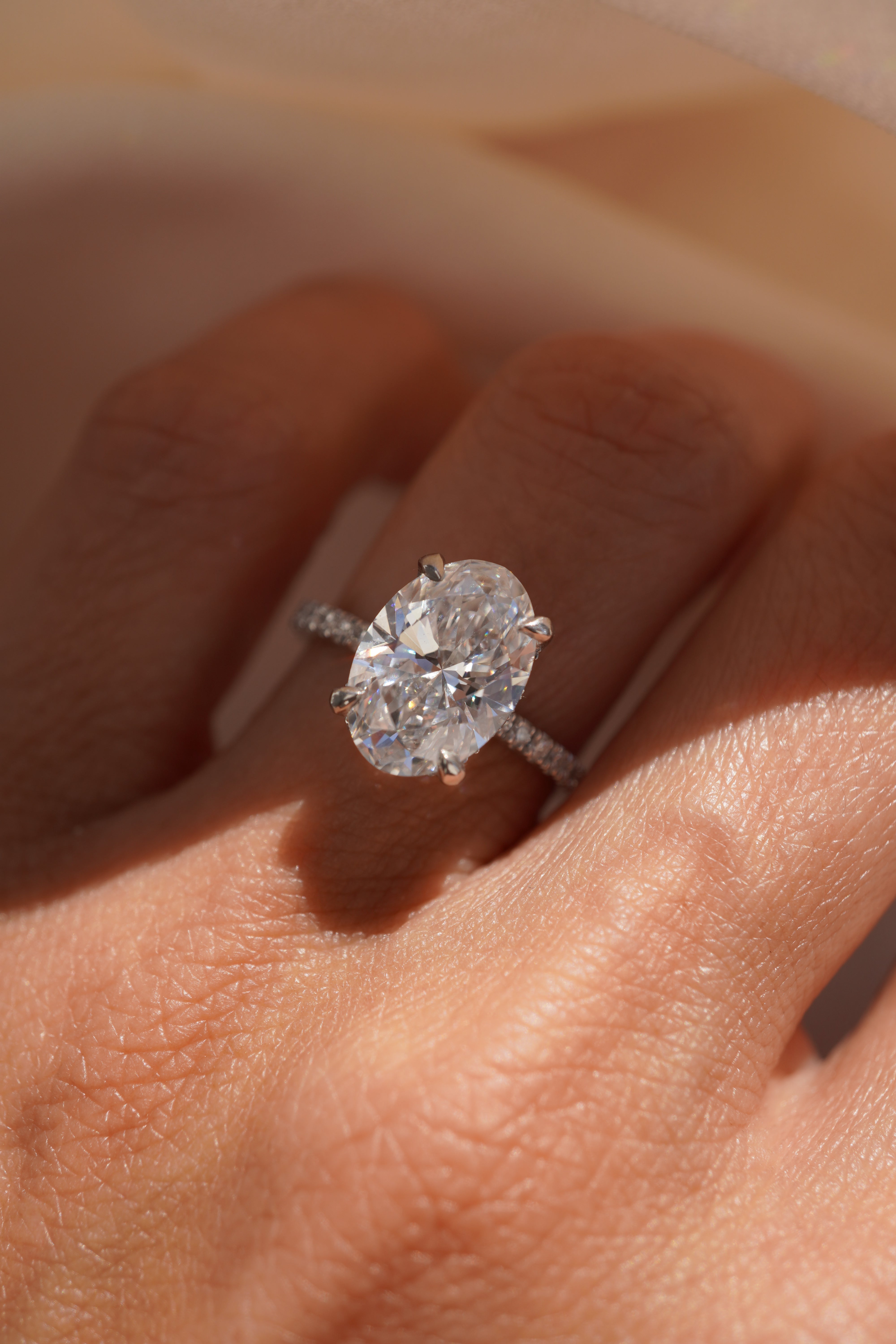 Oval Accented Solitaire with Hidden Halo
