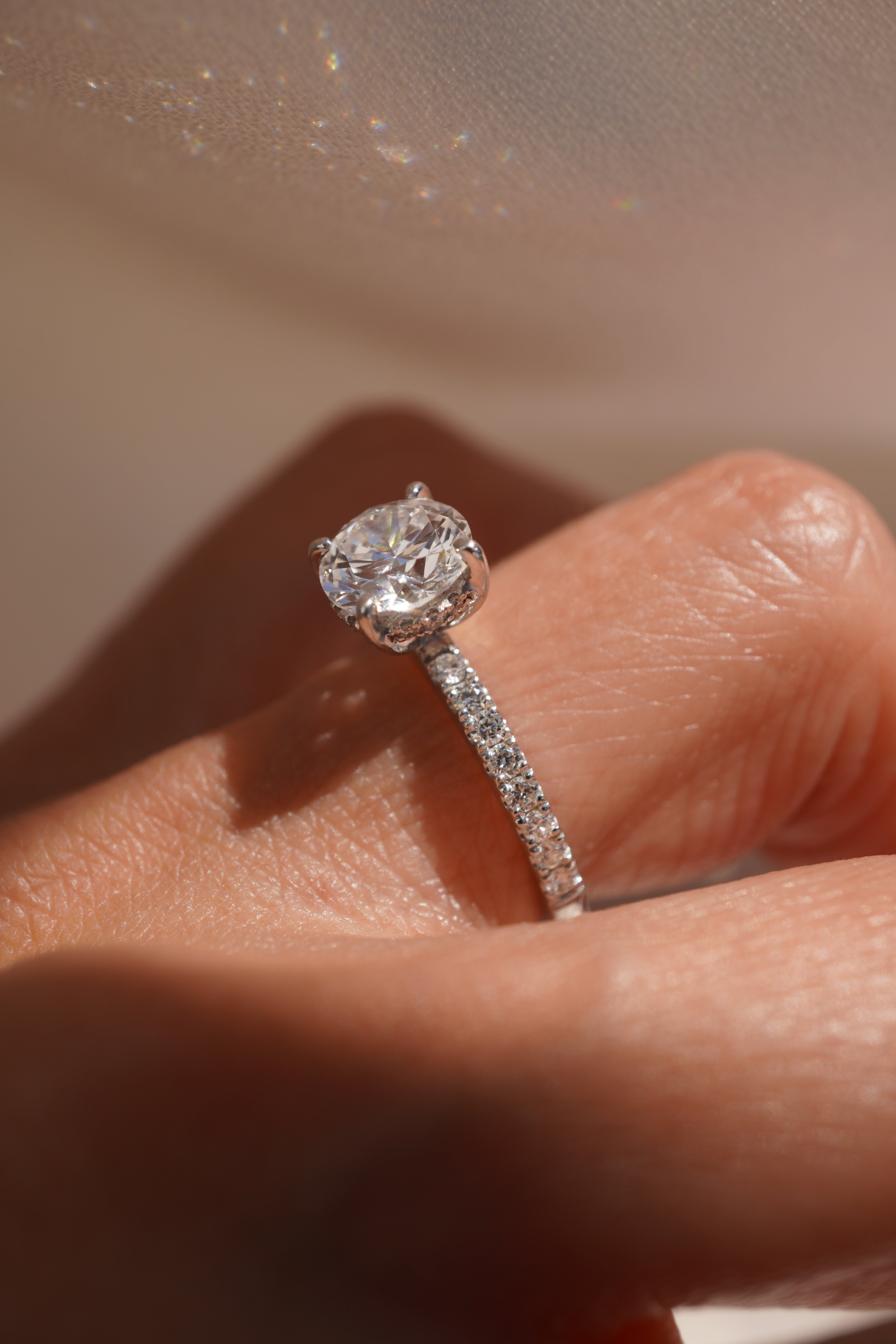 Round Accented Solitaire with Hidden Halo