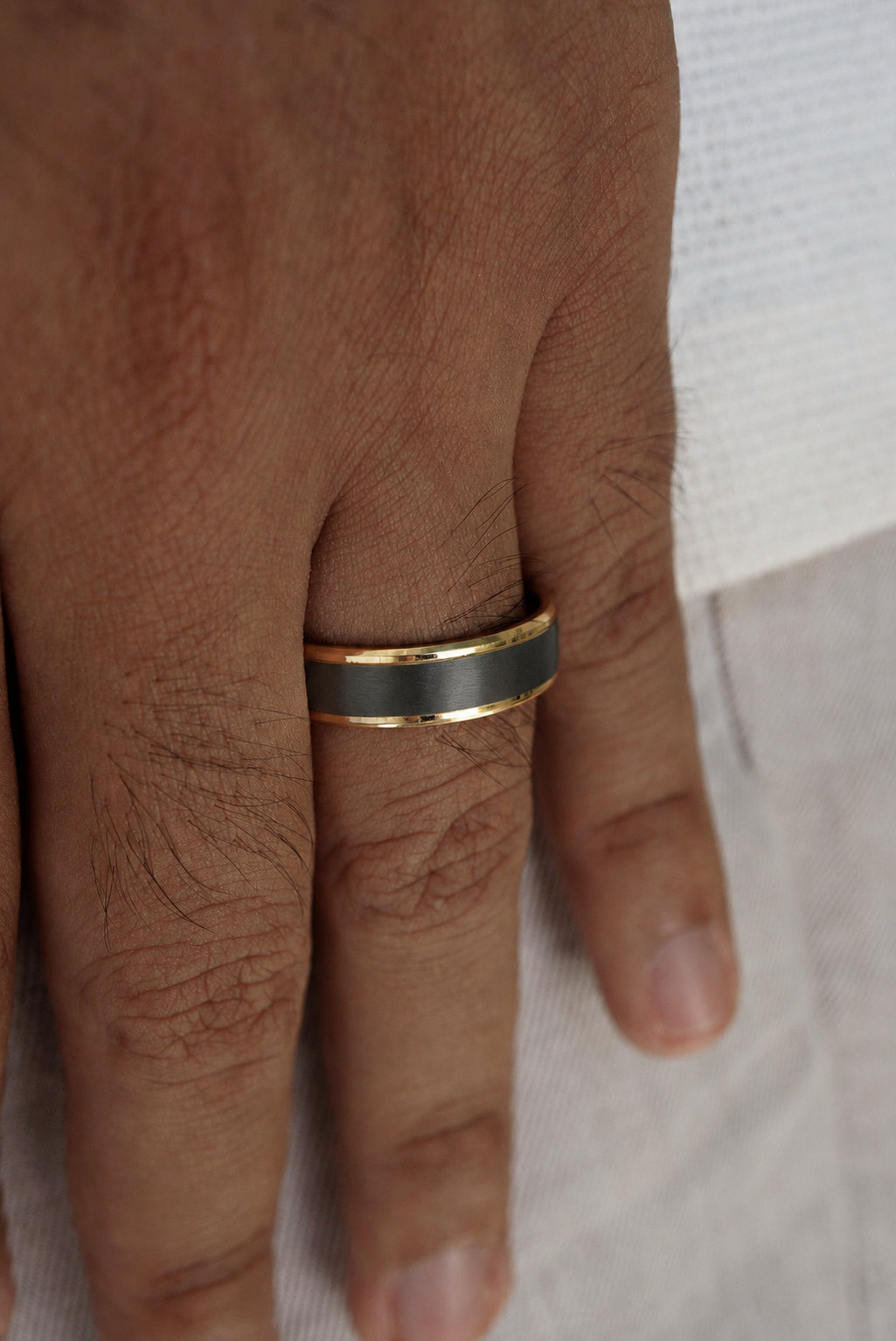 Charcoal and Gold Step Edge Band worn on hand